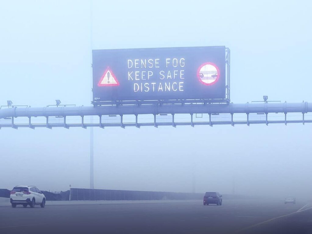 : Fog blankets Dubai skyline as motorists drive slowly during morning rush hour