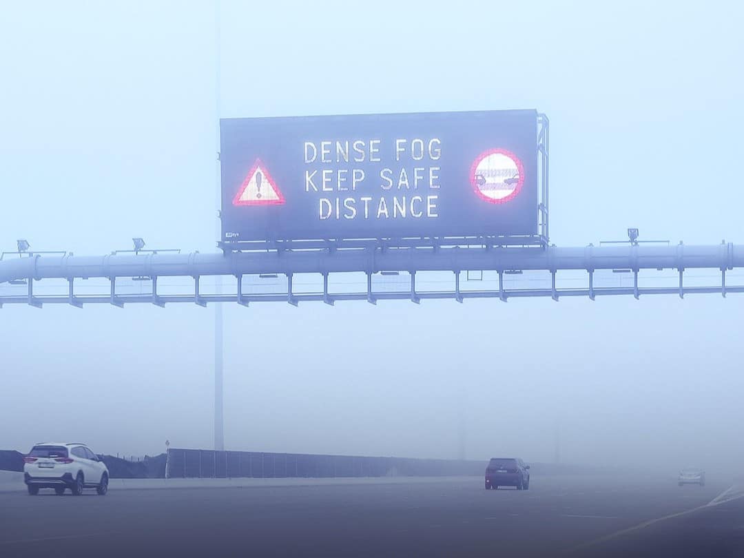 : Fog blankets Dubai skyline as motorists drive slowly during morning rush hour