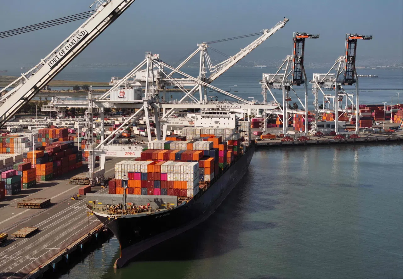Container cranes at Jebel Ali Port with vessels rerouted from the Red Sea